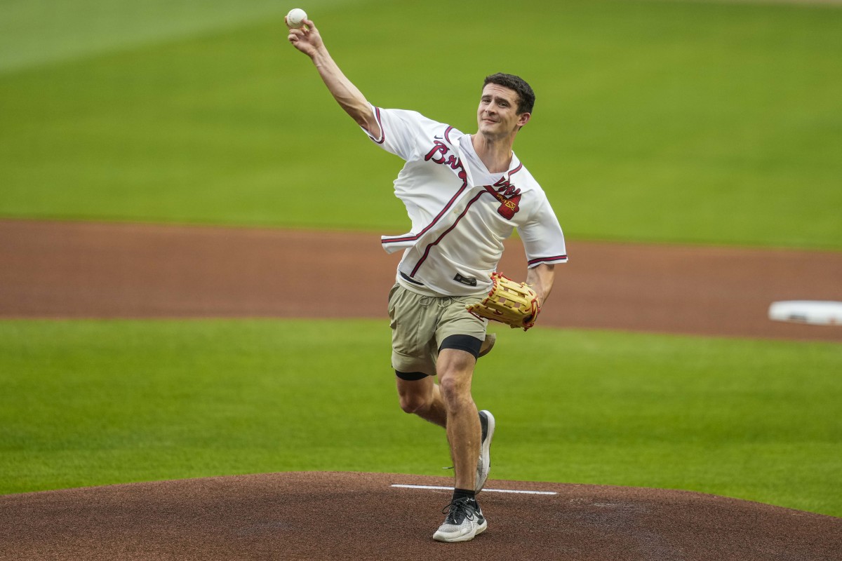 Apr 6, 2023; Cumberland, Georgia, USA; Former Georgia quarterback Stetson Bennett IV throws out the opening pitch on the field before the game between the Atlanta Braves and the San Diego Padres at Truist Park. (Dale Zanine / USA TODAY Sports).